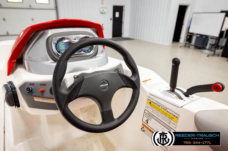 Slide: The Image of 2007 Sea Doo 150 Speedster dashboard with steering wheel and controls in a showroom. - 20
