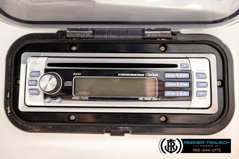 Slide: The Image of Clarion marine stereo in a 2007 Sea Doo 150 Speedster boat dashboard. - 22