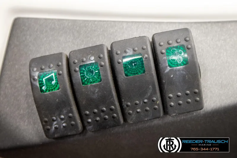 Slide: The Image of Dashboard switches on a 2007 Sea Doo 150 Speedster boat. - 25