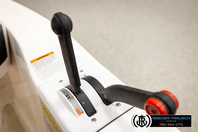 Slide: The Image of Close-up of 2007 Sea Doo 150 Speedster throttle controls with warning label. - 26