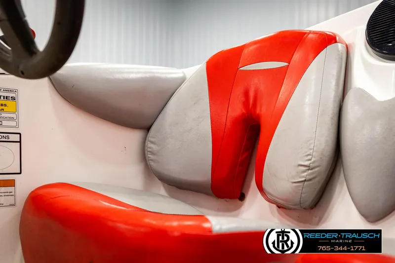 Slide: The Image of 2007 Sea Doo 150 Speedster interior with red and gray seating, Reeder-Trausch Marine logo visible. - 28