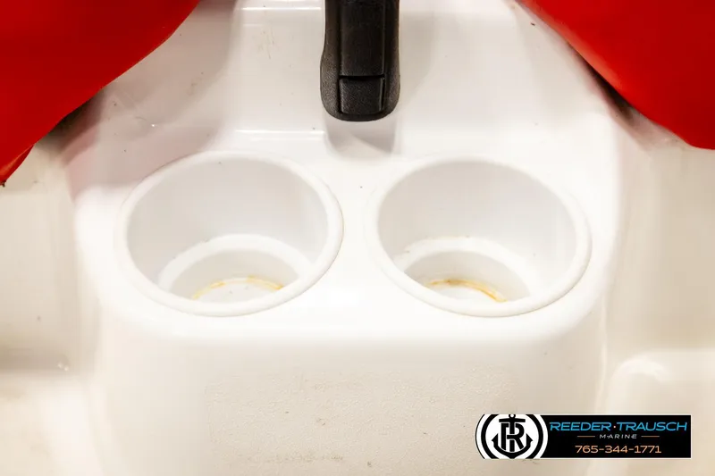Slide: The Image of Cup holders on a 2007 Sea Doo 150 Speedster boat, featuring red accents. - 29