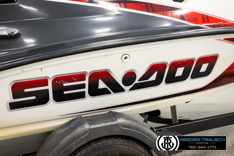 Slide: The Image of 2007 Sea Doo 150 Speedster boat with bold logo on side. - 37