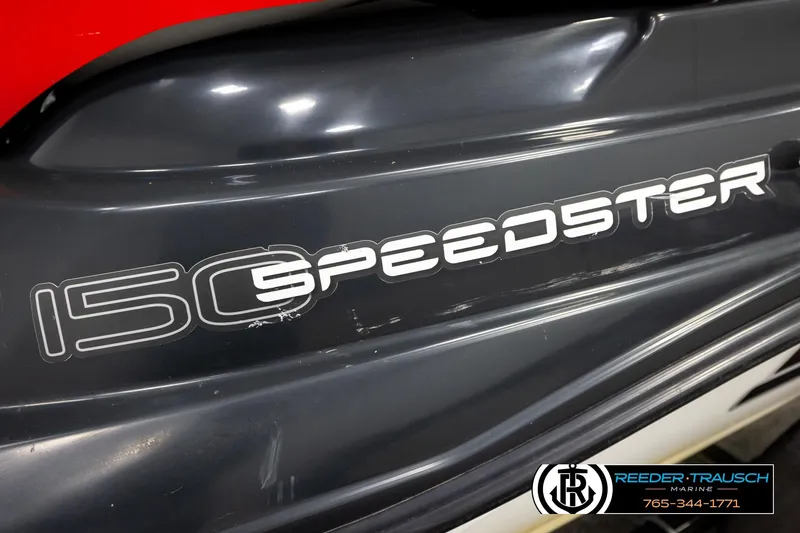 Slide: The Image of Close-up of 2007 Sea Doo 150 Speedster logo on a sleek black surface. - 39