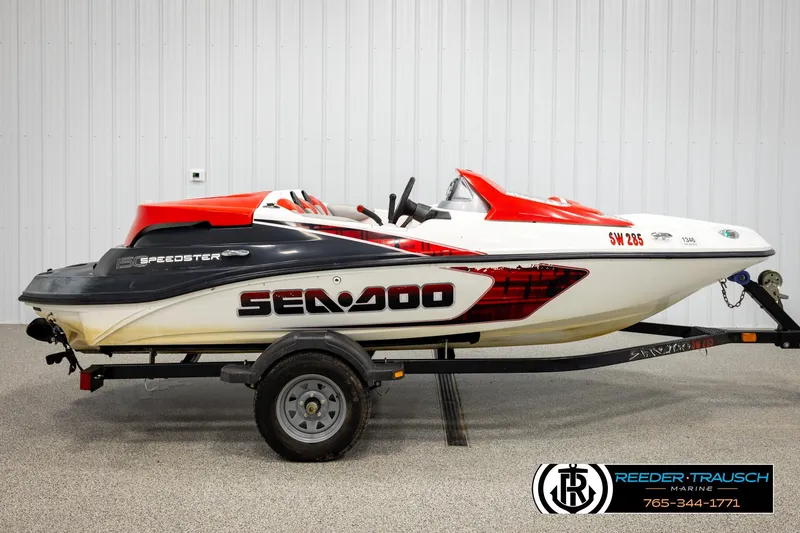 Slide: The Image of 2007 Sea Doo 150 Speedster jet boat on trailer, side view in showroom. - 4