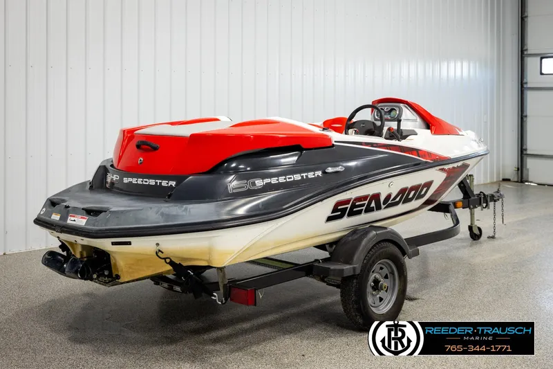 Slide: The Image of 2007 Sea Doo 150 Speedster jet boat on trailer in indoor setting. - 5