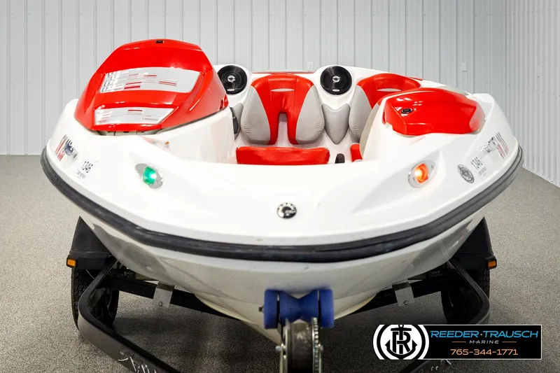 Slide: The Image of 2007 Sea Doo 150 Speedster, red and white, displayed indoors on a trailer. - 7