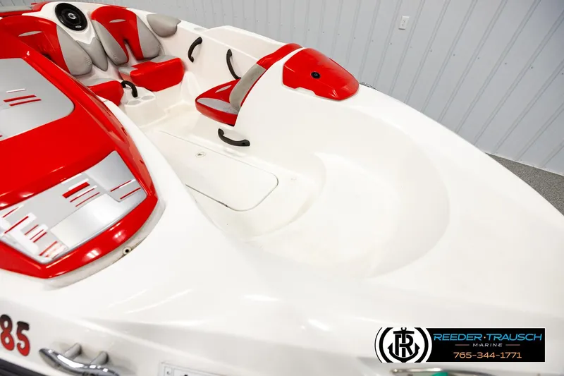 Slide: The Image of 2007 Sea Doo 150 Speedster boat interior with red and gray seating. - 8