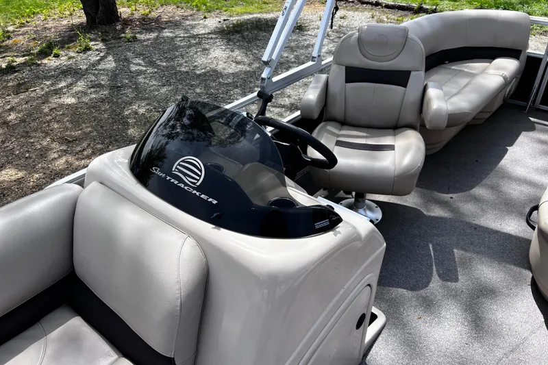 Slide: The Image of 2017 Sun Tracker Party Barge 22 DLX interior with helm and seating. - 15