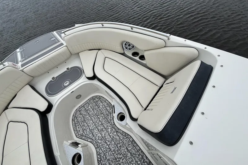 Slide: The Image of 2021 Stingray 231 DC boat with 200 HP motor on water. - 14