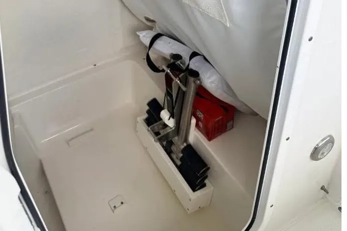 Slide: The Image of Storage compartment of 2023 Sea Hunt Ultra 239 SE boat, featuring organized equipment and accessories. - 14