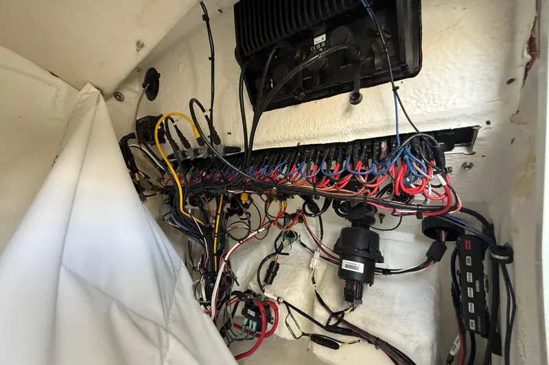 Slide: The Image of Electrical wiring inside a 2023 Sea Hunt Ultra 239 SE boat. - 16