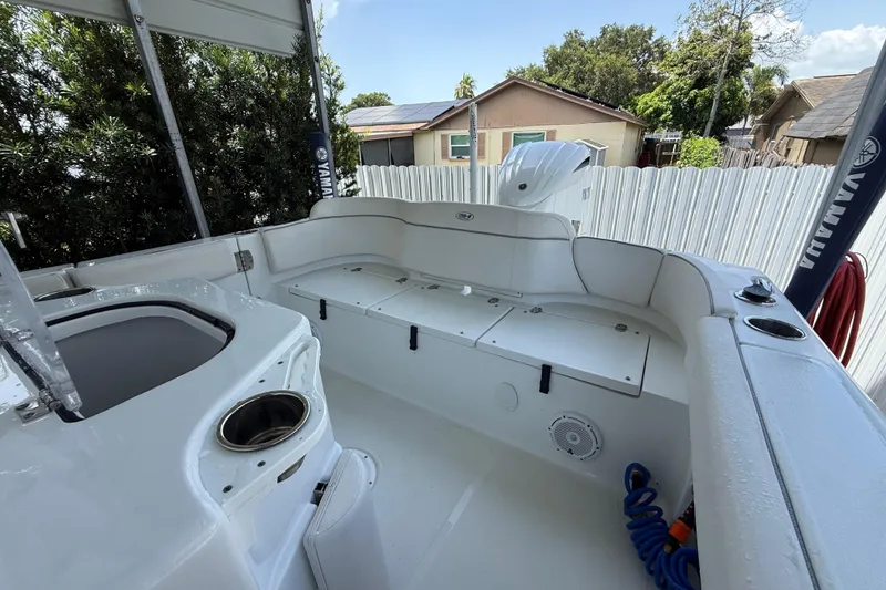 Slide: The Image of 2023 Sea Hunt Ultra 239 SE boat interior with seating and storage compartments. - 3