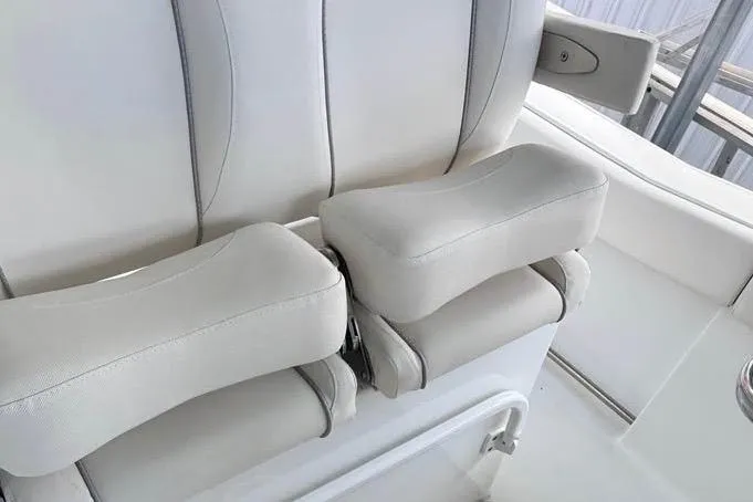 Slide: The Image of Luxurious seating on 2023 Sea Hunt Ultra 239 SE boat, featuring plush white cushions. - 6