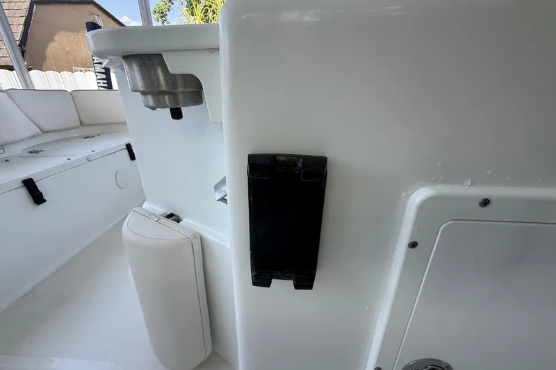 Slide: The Image of Interior view of 2023 Sea Hunt Ultra 239 SE boat, featuring seating and storage compartments. - 6