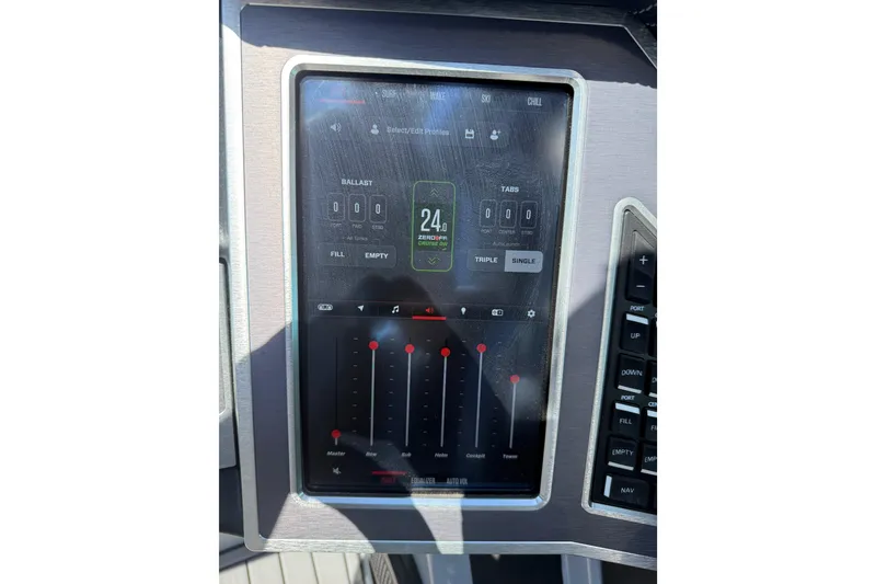 Slide: The Image of 2023 MasterCraft XT24 touchscreen control panel displaying ballast and audio settings. - 11