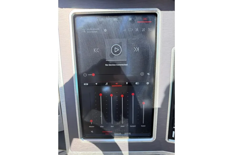 Slide: The Image of 2023 MasterCraft XT24 touchscreen display showing audio controls and Bluetooth connectivity options. - 13