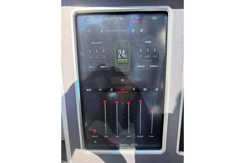 Slide: The Image of 2023 MasterCraft XT24 touchscreen control panel displaying ballast and audio settings. - 14