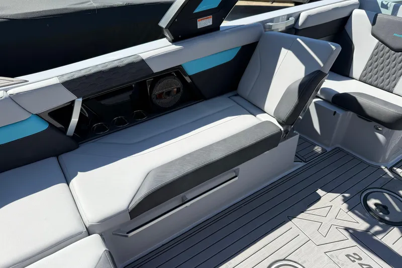 Slide: The Image of 2023 MasterCraft XT24 boat interior with sleek seating and modern design elements. - 18