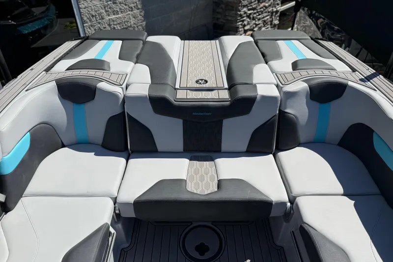Slide: The Image of 2023 MasterCraft XT24 boat interior with modern seating and stylish design. - 21