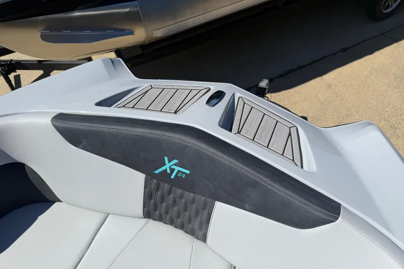 Slide: The Image of 2023 MasterCraft XT24 boat interior with sleek design and modern upholstery. - 3