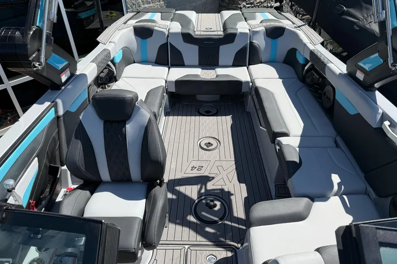 Slide: The Image of 2023 MasterCraft XT24 boat interior with luxurious seating and modern design. - 6