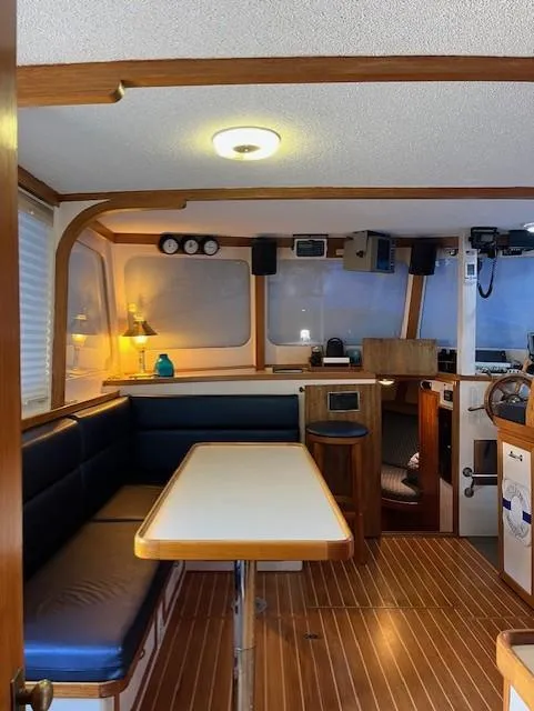Slide: The Image of Interior of 1972 DeFever 38 Passagemaker with wooden accents and cozy seating area. - 10