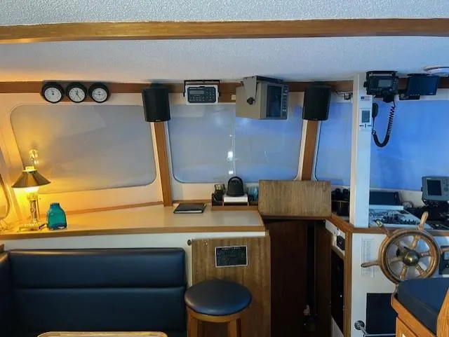 Slide: The Image of Interior of a 1972 DeFever 38 Passagemaker with navigation equipment and seating area. - 20