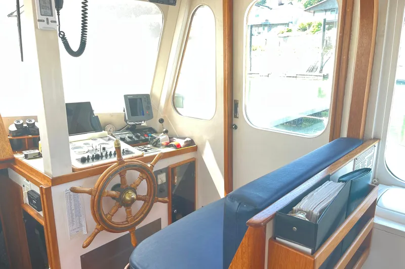 Slide: The Image of Interior of a 1972 DeFever 38 Passagemaker with wooden helm and navigation equipment. - 21
