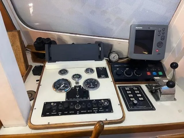 Slide: The Image of Control panel of a 1972 DeFever 38 Passagemaker with navigation instruments and gauges. - 24