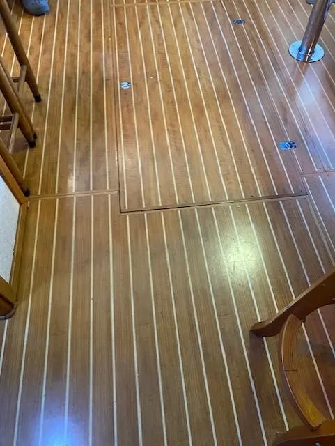 Slide: The Image of Teak flooring on 1972 DeFever 38 Passagemaker boat interior. - 35