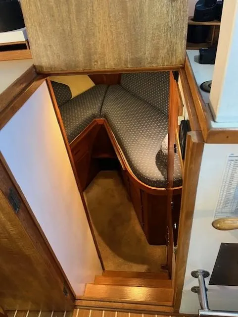 Slide: The Image of Interior cabin view of a 1972 DeFever 38 Passagemaker with wooden finish and V-berth. - 37