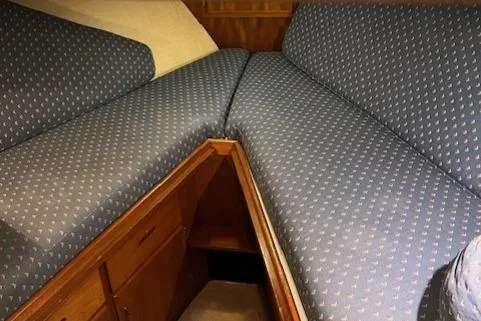 Slide: The Image of Interior cabin of 1972 DeFever 38 Passagemaker with patterned blue cushions. - 38