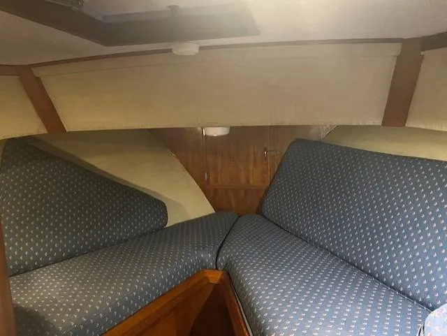 Slide: The Image of Interior cabin of 1972 DeFever 38 Passagemaker with blue patterned cushions. - 41