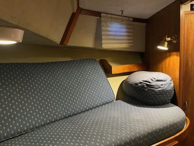 Slide: The Image of Cozy cabin interior of 1972 DeFever 38 Passagemaker with cushioned seating and ambient lighting. - 42