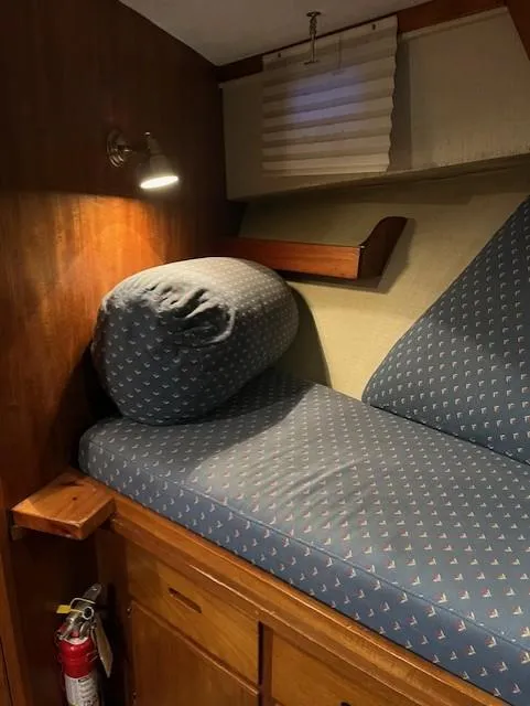 Slide: The Image of Cozy cabin interior of 1972 DeFever 38 Passagemaker with patterned cushions and wooden accents. - 44
