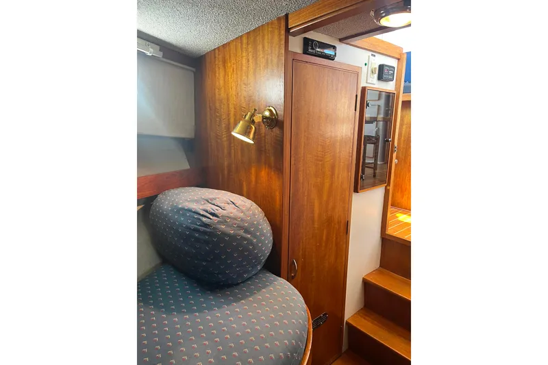 Slide: The Image of Cozy cabin interior of 1972 DeFever 38 Passagemaker with wooden paneling and cushioned seating. - 45