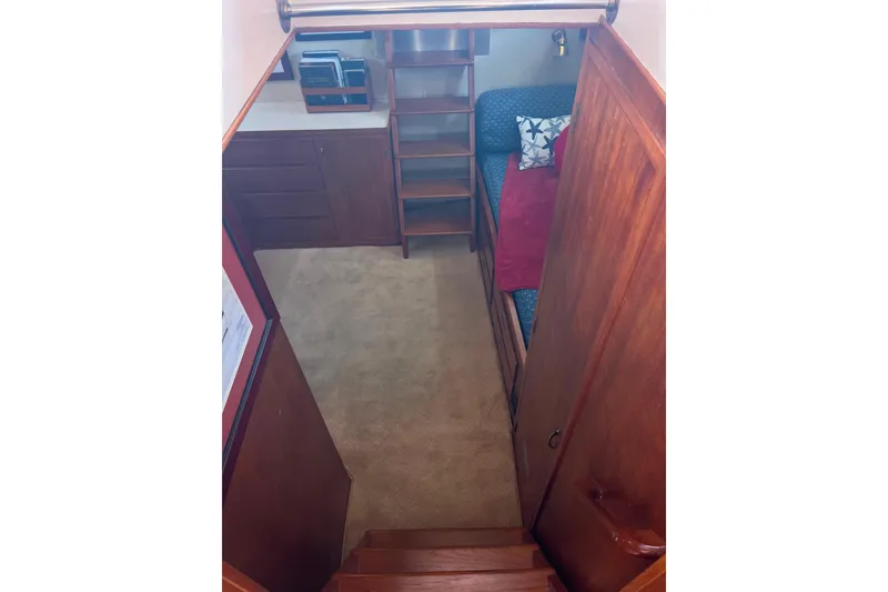 Slide: The Image of Interior of 1972 DeFever 38 Passagemaker with wooden cabinetry and cozy seating area. - 49