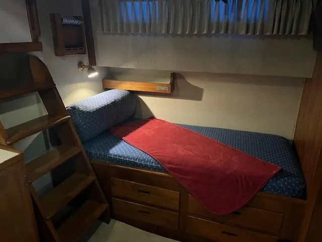 Slide: The Image of Cozy cabin interior of 1972 DeFever 38 Passagemaker with bed and wooden storage. - 51