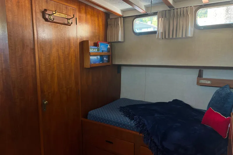 Slide: The Image of Cozy cabin interior of 1972 DeFever 38 Passagemaker with wooden accents and nautical decor. - 56
