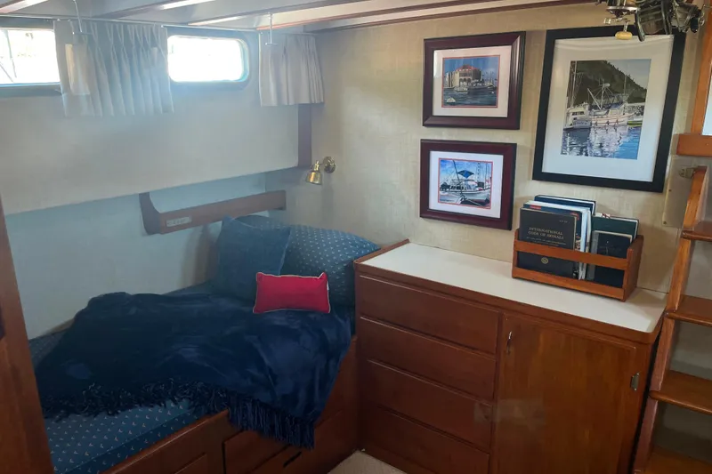 Slide: The Image of Cozy cabin interior of 1972 DeFever 38 Passagemaker with bed, framed art, and books. - 57