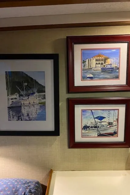 Slide: The Image of Framed nautical paintings on a wall inside a 1972 DeFever 38 Passagemaker yacht. - 61