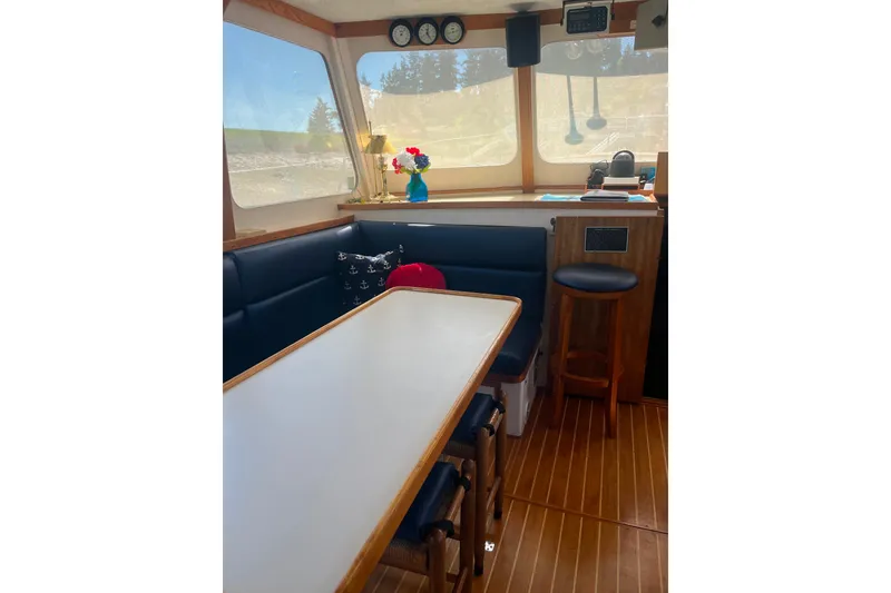 Slide: The Image of Interior of 1972 DeFever 38 Passagemaker with dining area and nautical decor. - 9