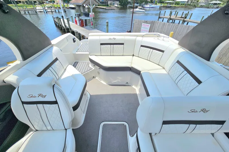 Slide: The Image of Luxurious interior of 2018 Sea Ray SLX 230 boat with elegant seating and waterfront view. - 12