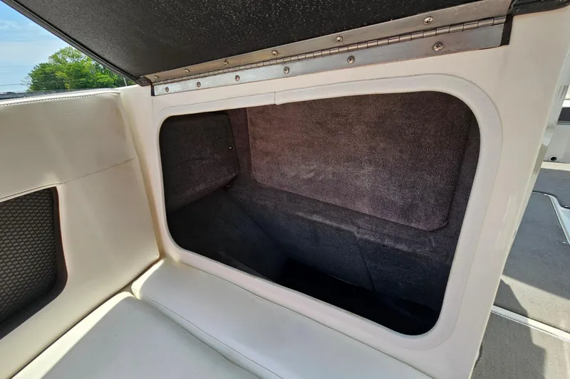 Slide: The Image of Storage compartment in a 2018 Sea Ray SLX 230 boat, featuring a spacious interior. - 27