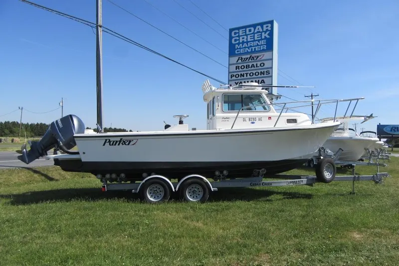 The Image of 2013 Parker 2320 SL Sport Cabin boat on trailer at Cedar Creek Marine Center. - 0