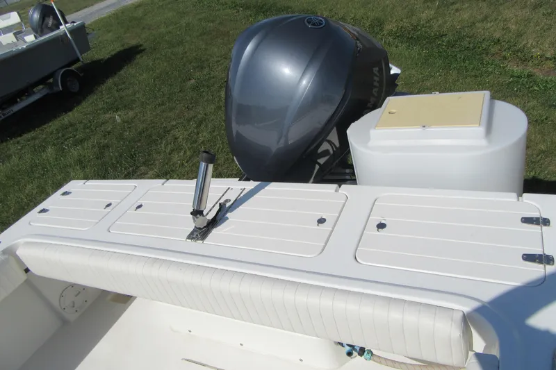 Slide: The Image of 2013 Parker 2320 SL Sport Cabin boat with Yamaha outboard motor on grassy area. - 11
