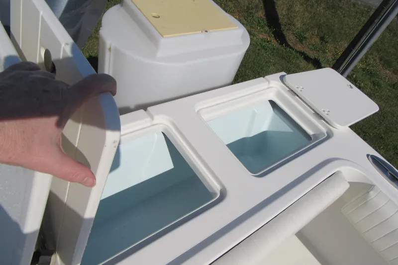 Slide: The Image of 2013 Parker 2320 SL Sport Cabin boat with open storage compartments. - 13