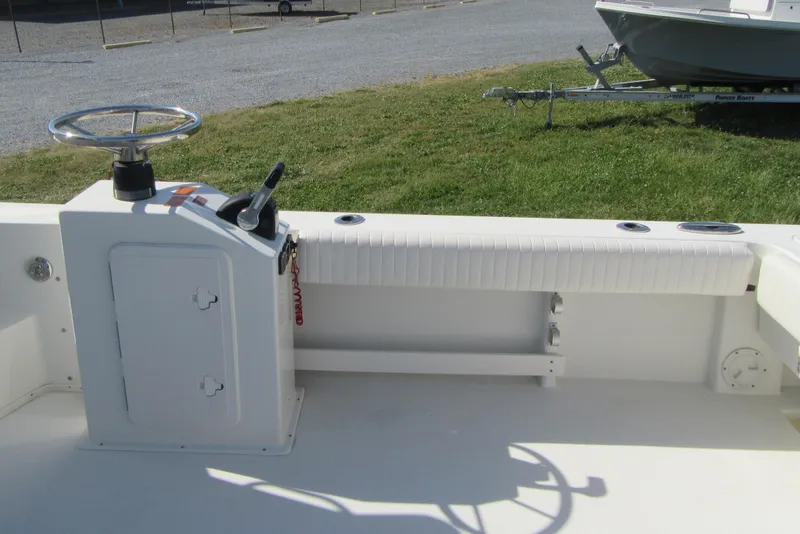 Slide: The Image of 2013 Parker 2320 SL Sport Cabin boat interior with steering console and seating. - 18