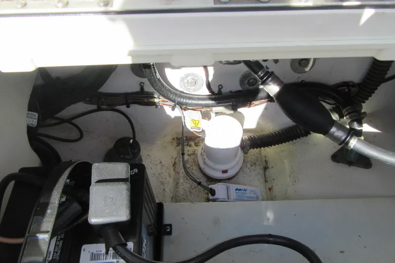 Slide: The Image of Engine compartment of a 2013 Parker 2320 SL Sport Cabin boat, showing wiring and components. - 22